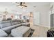 Bright open-concept living room showcasing the dining and kitchen area with modern furnishings at 3886 Reflection Dock Dr, Seffner, FL 33584