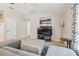 Comfortable living room featuring neutral paint colors, tile flooring, and modern decor at 3886 Reflection Dock Dr, Seffner, FL 33584