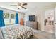 Inviting bedroom offering neutral walls, plush carpet, and a view of the backyard at 3886 Reflection Dock Dr, Seffner, FL 33584