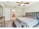 Spacious bedroom with neutral decor, plush carpet, and an ensuite bathroom at 3886 Reflection Dock Dr, Seffner, FL 33584