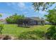 Lush backyard featuring a screened patio and plenty of green space at 4009 Clear Spring Rd, Brooksville, FL 34604