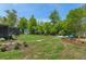 Expansive backyard with a shed, screened patio, and a fire pit, perfect for entertaining at 4009 Clear Spring Rd, Brooksville, FL 34604