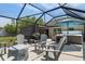 Screened patio, showcasing the seating area and hot tub, for relaxation at 4009 Clear Spring Rd, Brooksville, FL 34604