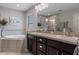 Luxurious bathroom with a double vanity, walk-in shower, and soaking tub for relaxation at 4009 Clear Spring Rd, Brooksville, FL 34604