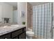 Bathroom showcasing a single sink vanity with modern finishes and a shower with a patterned shower curtain at 4009 Clear Spring Rd, Brooksville, FL 34604