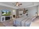Comfortable bedroom featuring stylish furnishings, a tray ceiling, and modern decorative accents at 4009 Clear Spring Rd, Brooksville, FL 34604