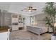 Spacious bedroom with tray ceilings, a ceiling fan, and neutral decor accents at 4009 Clear Spring Rd, Brooksville, FL 34604