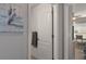 An entryway that opens up to a bedroom with a desk, chair and a ceiling fan in the background at 4009 Clear Spring Rd, Brooksville, FL 34604