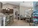 Cozy dining area features a banquette, table with chairs, and a beach-themed art piece at 4009 Clear Spring Rd, Brooksville, FL 34604