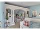 Inviting foyer with tiled floors, stylish columns, arched entryways, neutral paint, and views to the living room and back yard at 4009 Clear Spring Rd, Brooksville, FL 34604