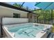 Close-up of a pristine hot tub, highlighting its jets and comfortable seating at 4009 Clear Spring Rd, Brooksville, FL 34604