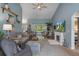 Spacious living room with vaulted ceilings, tiled floors, and views to the back yard from french doors at 4009 Clear Spring Rd, Brooksville, FL 34604