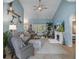 Spacious living room with vaulted ceilings, tiled floors, and views to the back yard from french doors at 4009 Clear Spring Rd, Brooksville, FL 34604
