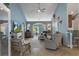 Spacious living room with vaulted ceilings, tiled floors, and views to the back yard from french doors at 4009 Clear Spring Rd, Brooksville, FL 34604