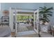A view to a large screened patio and backyard, with a pair of french doors leading to the interior at 4009 Clear Spring Rd, Brooksville, FL 34604