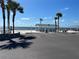 Lovely beach and picnic shelter featuring sandy beachfront and palm trees at 4854 Marine Pkwy # 103, New Port Richey, FL 34652