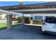 A covered parking area for the condominium complex, offering shade and protection at 4854 Marine Pkwy # 103, New Port Richey, FL 34652