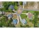 Aerial view of multiple residences in a well-planned community with lush landscaping at 487 Waterloo Ct, Spring Hill, FL 34609