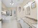 Bright bathroom with double vanity, granite countertops, and soaking tub at 487 Waterloo Ct, Spring Hill, FL 34609