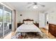 Bedroom featuring wood laminate flooring, and a sliding glass door to a deck at 487 Waterloo Ct, Spring Hill, FL 34609