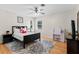 Cozy bedroom with wooden floors, ceiling fan and bright windows at 487 Waterloo Ct, Spring Hill, FL 34609