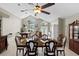 Elegant dining room with a large table, chairs, and open view of a game room and entryway at 487 Waterloo Ct, Spring Hill, FL 34609