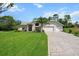 Beautiful single-story home with a well-manicured lawn and a spacious driveway at 487 Waterloo Ct, Spring Hill, FL 34609