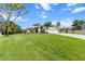 Spacious single-story home with a large front yard, two-car garage, and well-maintained landscaping at 487 Waterloo Ct, Spring Hill, FL 34609