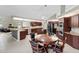 Spacious kitchen with stainless steel appliances, granite countertops and adjacent breakfast area at 487 Waterloo Ct, Spring Hill, FL 34609