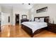 Large main bedroom featuring wood floors and a walk-in closet entrance at 487 Waterloo Ct, Spring Hill, FL 34609