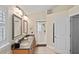Bathroom featuring double sinks, modern lighting fixtures, granite countertop, and a glass enclosed shower at 4923 Fort Peck Rd, New Port Richey, FL 34655