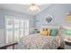 Bedroom featuring decorative pillows, closet, ceiling fan, stylish décor, and a view of the pool at 4923 Fort Peck Rd, New Port Richey, FL 34655