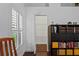 Bright room showcasing hardwood floors, storage, a window with plantation shutters, and a closet at 4923 Fort Peck Rd, New Port Richey, FL 34655
