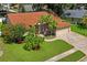 Desirable single-story home boasts brick-paved driveway, 2-car garage, and vibrant landscaping at 4923 Fort Peck Rd, New Port Richey, FL 34655