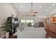 Spacious open-concept living area with views of the patio, modern furnishings, and hardwood floors at 4923 Fort Peck Rd, New Port Richey, FL 34655
