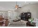 Comfortable living area featuring hardwood floors, neutral paint, lots of natural light and views into the dining area at 4923 Fort Peck Rd, New Port Richey, FL 34655