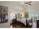 Tranquil main bedroom boasting dark wood floors, large windows, and a decorative wrought iron bed frame at 4923 Fort Peck Rd, New Port Richey, FL 34655