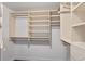 Spacious walk-in closet offering custom shelving and ample storage options at 4923 Fort Peck Rd, New Port Richey, FL 34655