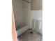 Bathroom with tiling half completed at 5111 Amulet Dr # 102, New Port Richey, FL 34652
