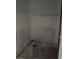 Small bathroom with grey walls, a towel bar, and an unfinished floor at 5111 Amulet Dr # 102, New Port Richey, FL 34652