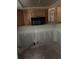 Kitchen with wood cabinets above a blank wall at 5111 Amulet Dr # 102, New Port Richey, FL 34652