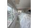Living room during renovations with multiple bright windows at 5111 Amulet Dr # 102, New Port Richey, FL 34652