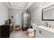 Bathroom with a glass shower, decorative tiles, updated vanity, and wood-look floors at 5363 Utopia Pl, Brooksville, FL 34601