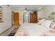 Spacious bedroom featuring a decorative bed frame, ample storage, and view of connecting room at 5363 Utopia Pl, Brooksville, FL 34601