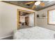 View of bedroom, showcasing wood trim, a sitting area, and closet space, from the bed at 5363 Utopia Pl, Brooksville, FL 34601