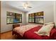 Inviting bedroom with large windows, a ceiling fan, and a relaxing atmosphere at 5363 Utopia Pl, Brooksville, FL 34601