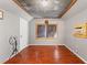 Spacious bonus room with hardwood floors and natural light, perfect for an office or entertainment space at 5363 Utopia Pl, Brooksville, FL 34601
