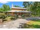 Charming home with a spacious front porch, metal roof, and natural wood facade at 5363 Utopia Pl, Brooksville, FL 34601