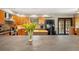 Kitchen featuring stainless steel appliances, a gray center island, and wood cabinets at 5363 Utopia Pl, Brooksville, FL 34601