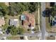 Overhead view of the home featuring a screened-in pool area, complemented by the surrounding neighborhood at 5423 Abagail Dr, Spring Hill, FL 34608